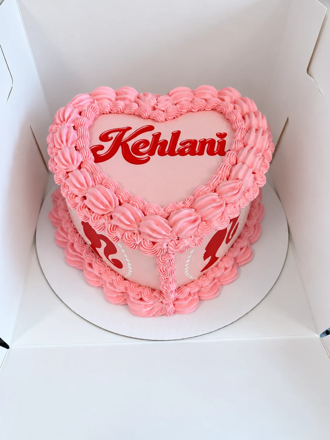 Pink heart-shaped Kehlani cake with vintage piping and Barbie details